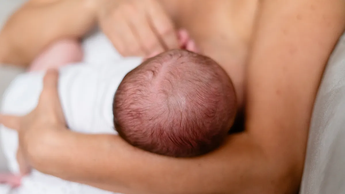 Close-up of a baby breastfeeding