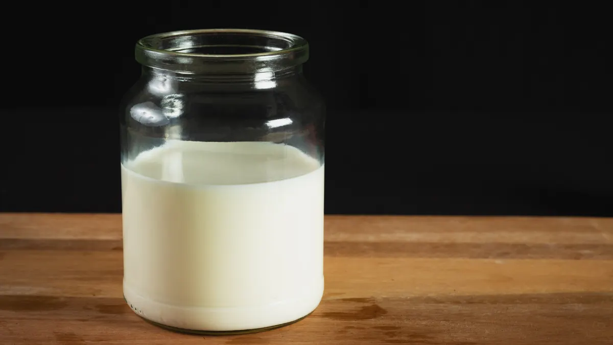 Glass jar filled with milk