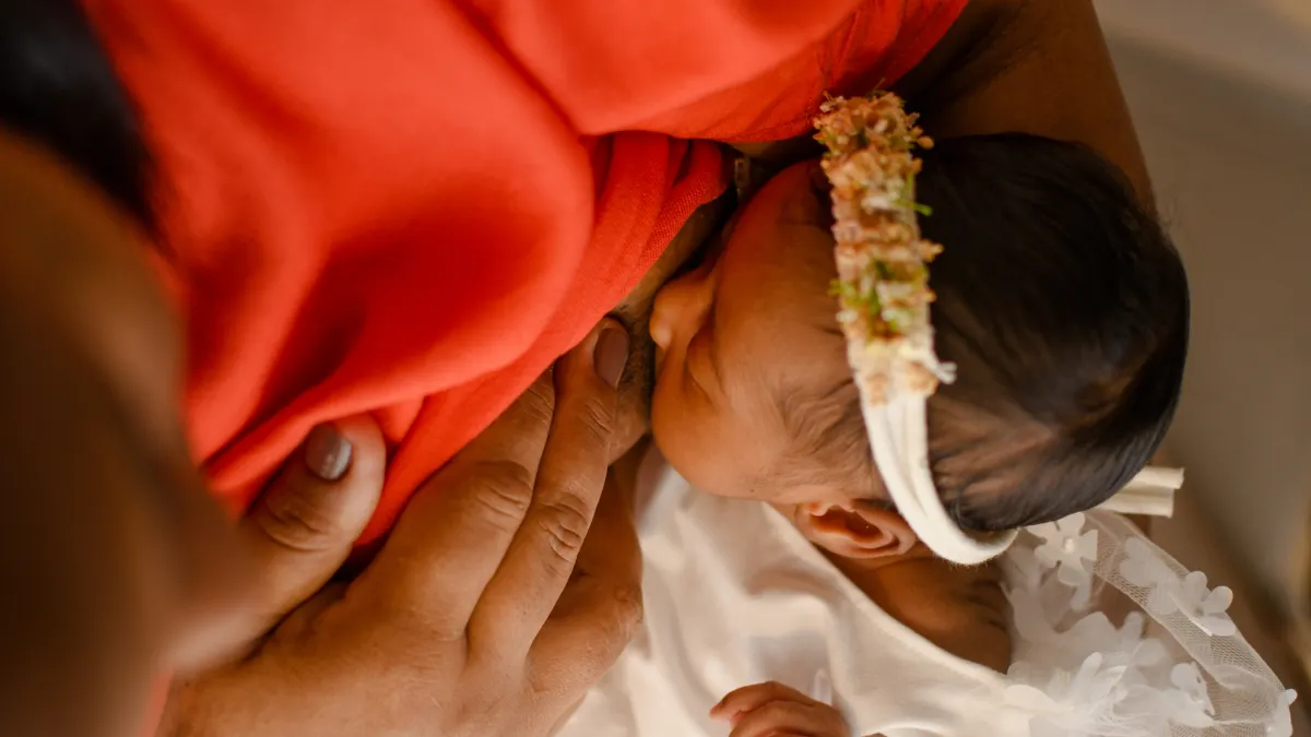 Mother breastfeeding a newborn close-up